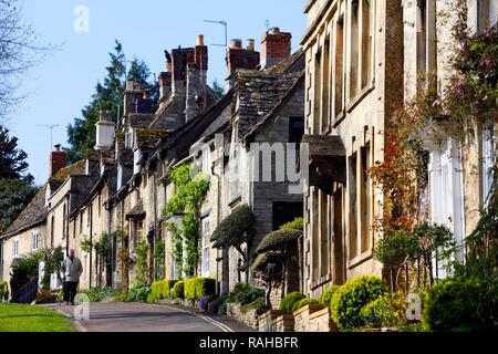 Row of old stone houses on High Street, Burford, Oxfordshire, United Kingdom, Europe Stock Photo