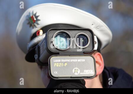 Laser measuring device being used by the police, speed trap marathon of the police in North Rhine-Westphalia, 24 hours of Stock Photo