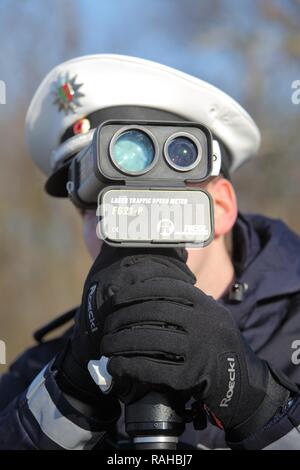 Laser measuring device being used by the police, speed trap marathon of the police in North Rhine-Westphalia, 24 hours of Stock Photo