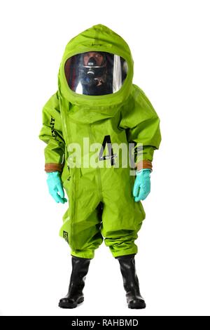 Firefighter wearing a chemical protective suit with air supply from a compressed air breathing apparatus, professional Stock Photo