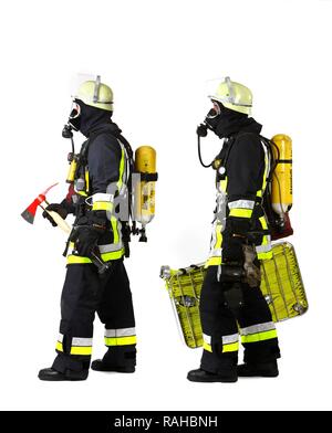 Firefighters, response squad for fire fighting, wearing protective clothing made of Nomex, a helmet with a visor, a fire axe, Stock Photo