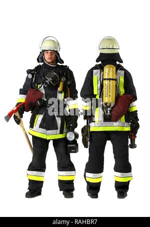 Firemen, part of a response squad for firefighting, with protective clothing made of Nomex, a helmet with a visor, a fire axe, Stock Photo