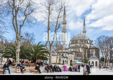 Istanbul, Turkey, April 2, 2015: People in Eyup Square, outside Eyup Sultan Mosque. Stock Photo