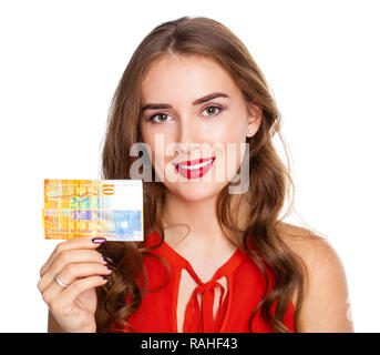 Young happy brunette woman holds a 10 Swiss francs, isolated on white background. Suisse francs bank note. Suisse franc is the national currency of Sw Stock Photo