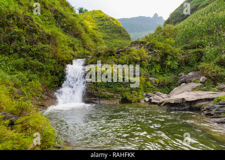 Waterfall and local swimming hole in mountain nature area near Ha Giang Loop, Ha Giang Province, Dong Van, Vietnam, Asia Stock Photo