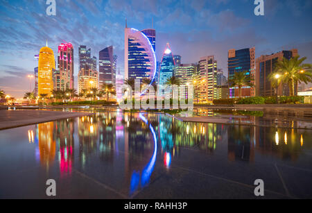 Evening skyline view of West Bay business district in Doha, Qatar Stock Photo