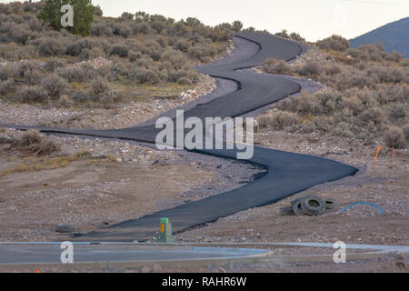 Winding road paved up a hill in Saratoga Springs Stock Photo