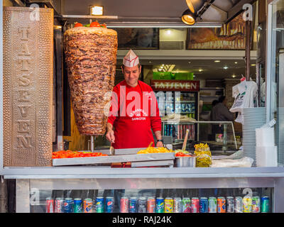 Istanbul, Turkey, February 24, 2015: Chef preparing kofte for sale in shop open to street. Stock Photo