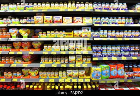 Baby food in jars, shelves, self-service Stock Photo