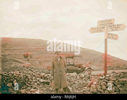 Tell el-Ful battlefield Army signpost. a man standing next to a signpost which reads 'Limerick Junction, Ramallah reimagined Stock Photo