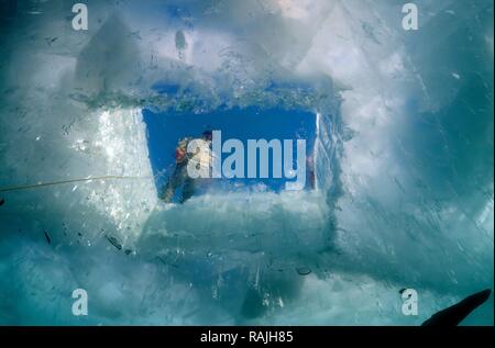 Diver, ice-diving, in Lake Baikal, Olkhon island, Siberia, Russia Stock Photo