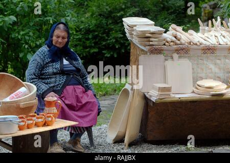 Street vendor selling pottery and wooden kitchen utensils, Sibiu, Transylvania, Romania, Europe Stock Photo