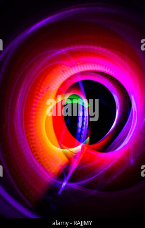 Abstract lights in circles and ovals of different sizes and colors. Light painting photo. Stock Photo