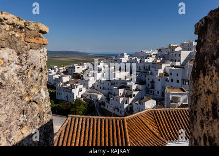 Small houses of a white village in the south of Spain. The red tile roofs are characteristic. Stock Photo