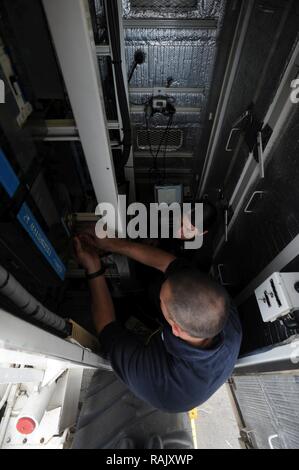 A carrier air crash crane (CVCC), nicknamed Tilly, is positioned on the ...