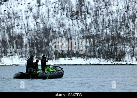 RAMSUND, Norway (Feb. 11, 2017) Members assigned to Mine Countermeasures Platoon 802 at Explosive Ordnance Disposal Mobile Unit 8, utilize a remotely operated vehicle in a cold weather environment to reacquire and neutralize underwater mines during Exercise Arctic Specialist 2017.  An adaptive force package commanded by Commander, Task Group 68.1, EOD Mobile Unit 8 is participating in Exercise Arctic Specialist 2017, a multi-national EOD exercise conducted in the austere environments of northern Norway. U.S. 6th Fleet, headquartered in Naples, Italy, conducts the full spectrum of joint and nav Stock Photo