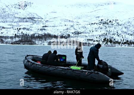 RAMSUND, Norway (Feb. 11, 2017) Members assigned to Mine Countermeasures Platoon 802 at Explosive Ordnance Disposal Mobile Unit 8, utilize a remotely operated vehicle in a cold weather environment to reacquire and neutralize underwater mines during Exercise Arctic Specialist 2017.  An adaptive force package commanded by Commander, Task Group 68.1, EOD Mobile Unit 8 is participating in Exercise Arctic Specialist 2017, a multi-national EOD exercise conducted in the austere environments of northern Norway. U.S. 6th Fleet, headquartered in Naples, Italy, conducts the full spectrum of joint and nav Stock Photo