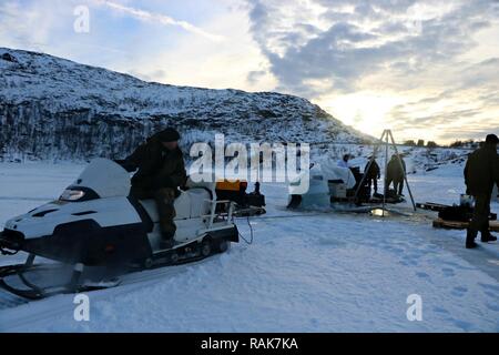 RAMSUND, Norway (Feb. 11, 2017) Members of the Royal Norwegian Navy Explosive Ordnance Disposal Command demonstrate ice diving ordnance recovery tactics, techniques, and procedures to members of Explosive Ordnance Disposal Mobile Unit (EODMU) 8 during Exercise Arctic Specialist 2017.  EODMU-8 is participating in Exercise Arctic Specialist 2017, a multi-national EOD exercise conducted in the austere environments of northern Norway. Stock Photo