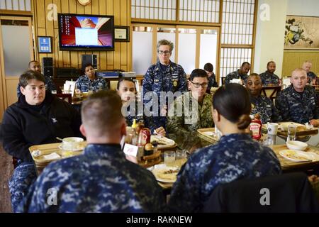 YOKOSUKA, Japan (Feb. 22, 2017) U.S. Pacific Fleet Master Chief Susan Whitman talks with Sailors during lunch at the Jewel of the East General Mess onboard Fleet Activities Yokosuka. Whitman listened to Sailor’s concerns and discussed items that affect ship and Sailor readiness and visited multiple shore and sea commands to ensure maximum readiness of shipboard and shore Sailors throughout the fleet. Stock Photo