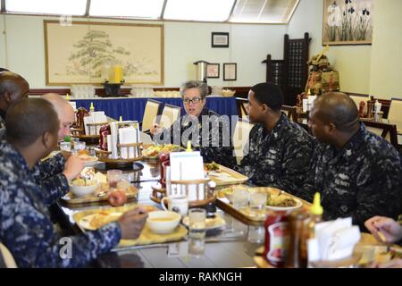 YOKOSUKA, Japan (Feb. 22, 2017) – U.S. Pacific Fleet Master Chief Susan Whitman talks with Sailors during lunch at the Jewel of the East General Mess on Fleet Activities Yokosuka (FLEACT) . Fleet Master Chief Whitman listened to Sailor’s concerns and discussed items that affect ship and Sailor readiness. During her visit to FLEACT she visited multiple shore and sea commands to ensure maximum readiness of shipboard and shore Sailors throughout the fleet. FLEACT Yokosuka provides, maintains, and operates base facilities and services in support of 7th Fleet's forward-deployed naval forces, 83 ten Stock Photo