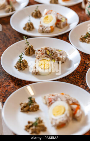 Meat jelly with egg on restaurant counter Stock Photo