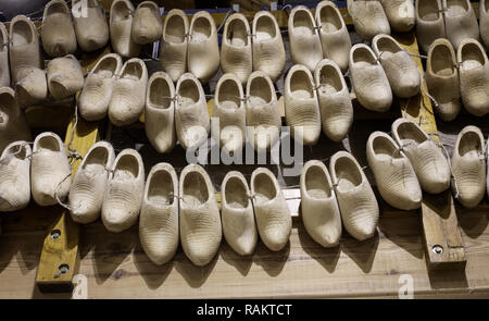 Dutch clogs craftsmen, manufacture of traditional footwear for the field Stock Photo