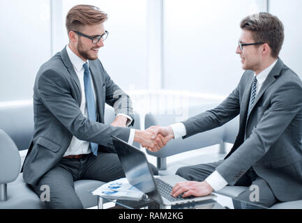 close up. businessman shaking hands with business partner Stock Photo