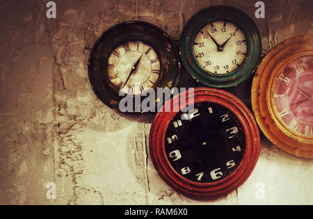 Abstract Retro Clocks on the Stone Wall Background Stock Photo