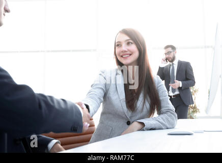 female consultant greeting the customer . Stock Photo