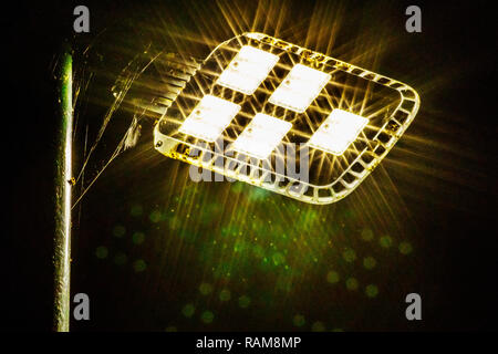 LED street lighting glare with phantom arrays, examples of Lambertian light distribution from LED exposed chip module street light luminaire Stock Photo