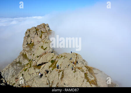 Hikers in the mountains. Foggy Rock mountain. Armenia Stock Photo
