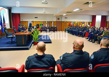 Commanding General, Brig. Gen. Giovanni Pietro Barbano (right), Center of Excellence for Stability Police Units (CoESPU) director, addresses dignitaries and guests from Europe, Africa, Italy and the U.S. during the Graduation Ceremony of the 14th Protection of Civilians Course at the CoESPU in Vicenza, Italy, Feb. 21, 2017.