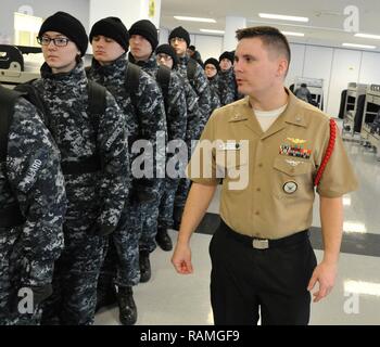 GREAT LAKES, Ill. (Feb. 17, 2017) Naval Aircrewman Helicopter 2nd Class Steven Leib, the Junior Sailor of the Year, instructs recruits from Division 101 prior to departing the compartment at Recruit Training Command. Recruits line themselves up in a height line for marching prior to leaving the compartment for any evolution. About 30,000-40,000 recruits graduate annually from the Navy's only boot camp. Stock Photo