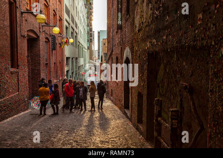 Tourists are visiting the gum wall at Pike Market in Downtown Seattle, Washington, United States. Stock Photo