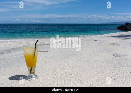 Mojito cocktail drink with evening sunset on beach background Stock Photo