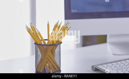 Graphite pencils in a metal grid-container. Concept. Stock Photo