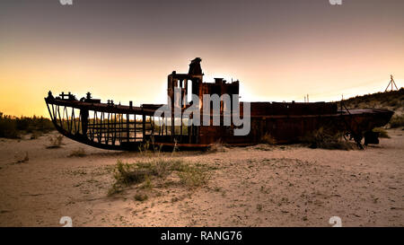 Panorama of ship cemetery at sunset near Moynaq at Karakalpakstan, Uzbekistan Stock Photo