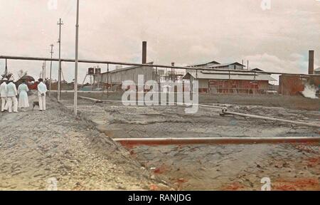 Sumatra indonesia Pangkalang-Brandan with group for factory complex, Anonymous, 1900 - 1920. Reimagined Stock Photo