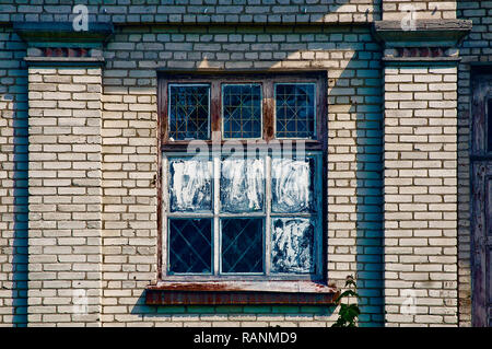 Old window of an antique soviet bricks building in the exposition center of Kiev, Ukraine Stock Photo