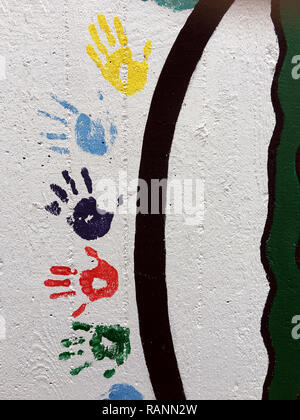 Graffiti Grunge Shape of Hand Symbol on Stone Wall Photo Stock Photo