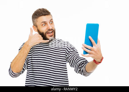 Happy nice man having a video call Stock Photo