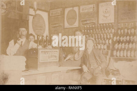 Vintage 1910 Photographic Postcard Showing Staff Inside a Shop or Licensed Premises Selling Alcohol. Stock Photo