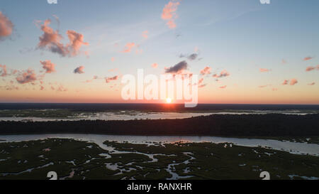 Aerial Drone View Landscape Coastal Nature Photograpy Serene Tranquil Early Morning Image Scenic Peaceful Sunbeam Reflections At Sunrise Over Horizon Stock Photo
