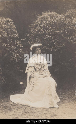 Vintage Photographic Postcard of a Lady Wearing an Elegant Costume, Possibly Dressed as a Queen. Stock Photo