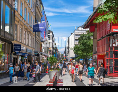 Shops and stores on the busy Drottninggatan, a major shopping street in the city centre, Norrmalm, Stockholm, Sweden Stock Photo