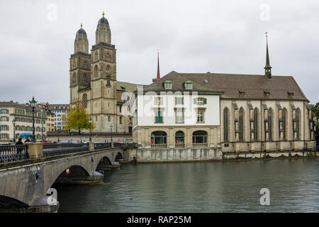 ZURICH, SWITZERLAND - OCT 130th, 2018: View of Grossmunster and Zurich old town from Limmat river. The Grossmunster is a Romanesque Protestant church in Zurich, Switzerland. Rainy weather in autumn. Stock Photo