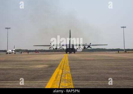 A Japanese Self-Defense Force C-130 aircraft taxis the runway  during a non-combatant evacuation operation exercise during  Cobra Gold 2017 at Utapao International Airport in Rayong  Province, Thailand, Feb. 19, 2017. Cobra Gold, in its 36th  iteration, focuses on humanitarian civic action, community  engagement, and medical activities to support the needs and  humanitarian interest of civilian populations around the region. Stock Photo