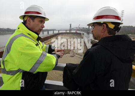 Tommy Long (Left), resident engineer for the Chickamauga Lock Replacement Project, explains how the river bed will be excavated ahead of future construction of the new 110-foot by 600-foot navigation lock to Douglas Lamont, senior official performing duties of secretary of the Army for Civil Works, during his visit to the lock on the Tennessee River in Chattanooga, Tenn., Feb. 28, 2017. (USACE Stock Photo