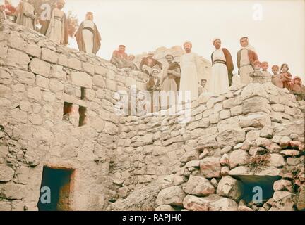 Halhul village at kilometer 30 on Hebron road Villagers on roof of semi subterranean houses. 1940, West Bank, Ḥalḥūl reimagined Stock Photo