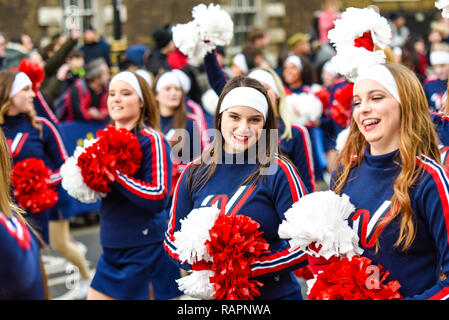 Varsity Spirit All American Cheerleaders at London's New Year's Day Parade, UK. Blue costumes. Cheerleading girls Stock Photo